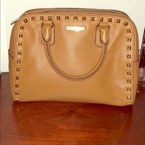 Micheal Kors tan and gold metal trim purse